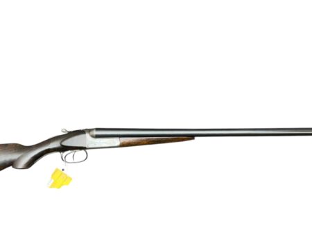 Side view of a lever-action rifle with a dark wooden stock and long metal barrel, shown against a white background.