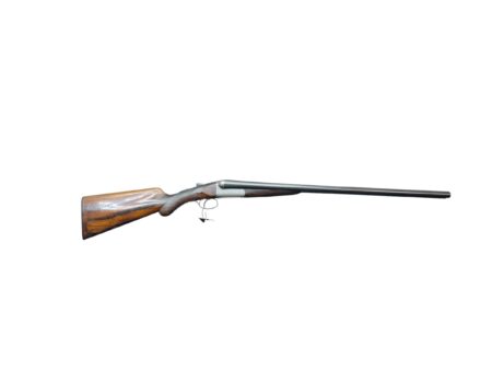 Long wooden-stock hunting rifle shown in profile with metal barrel against a white background, pointing to the right.