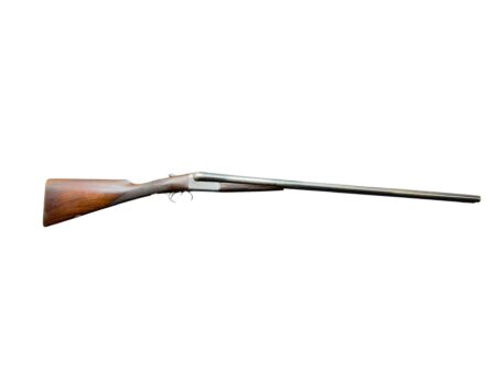 Side view of a classic double-barreled shotgun with a wooden stock and metal barrels against a white background