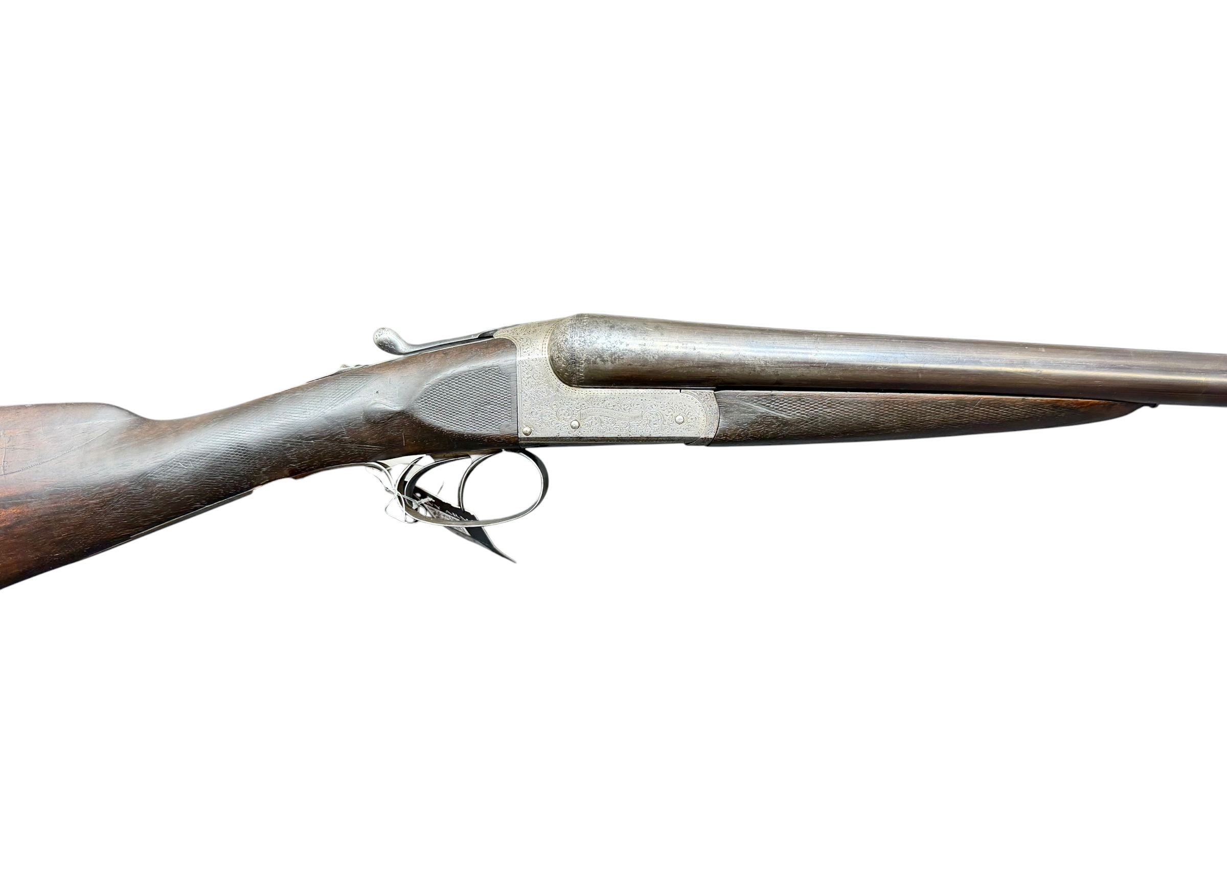 IMG_5309-Photoroom - OWS-Ammo Side view of an antique rifle with a wood stock and intricately engraved metal receiver on a white background.