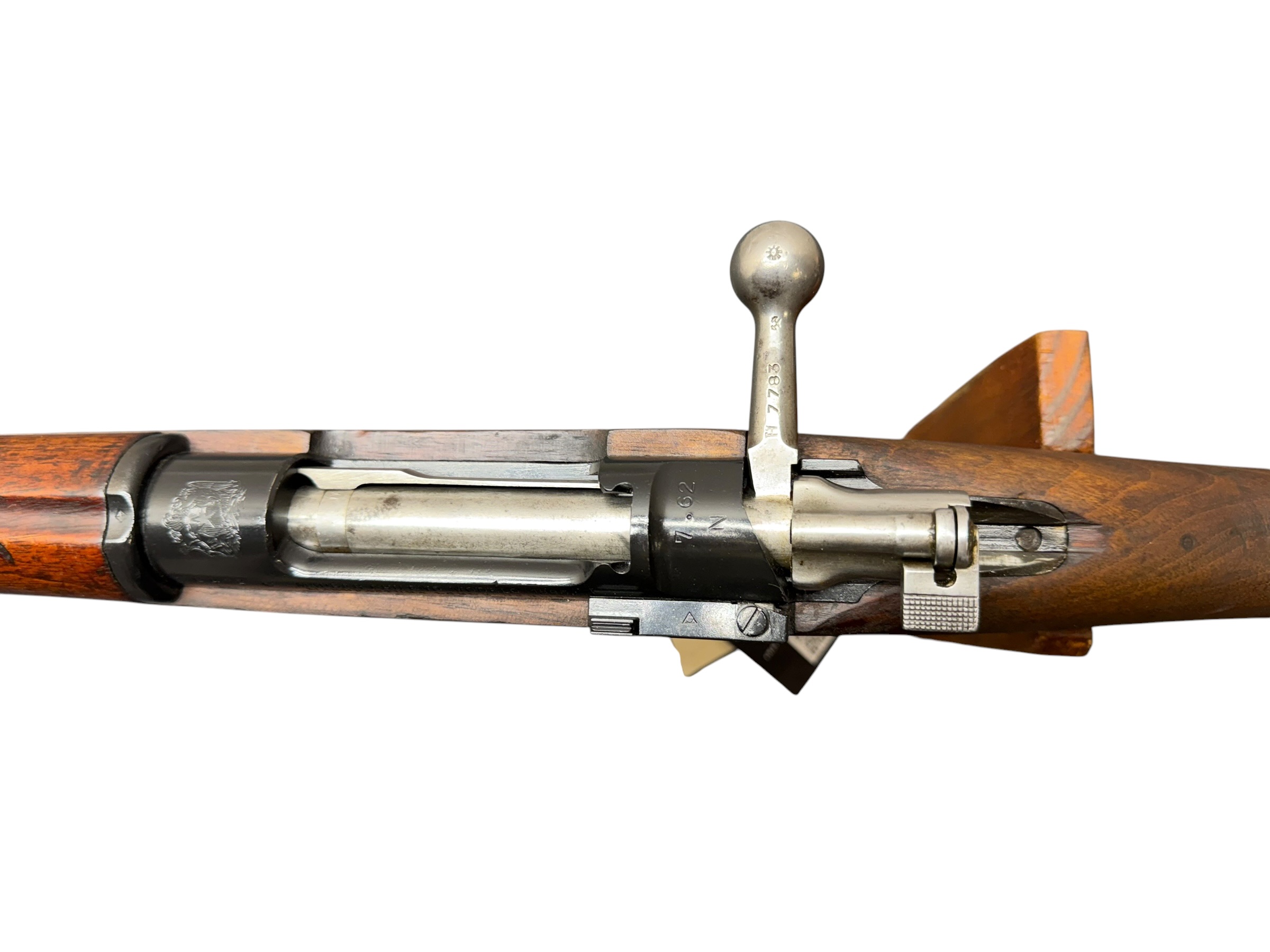 IMG_5333-Photoroom - OWS-Ammo Close-up of the lever-action rifle's receiver and wooden stock, showing the hammer and lever mechanism from a vintage firearm.