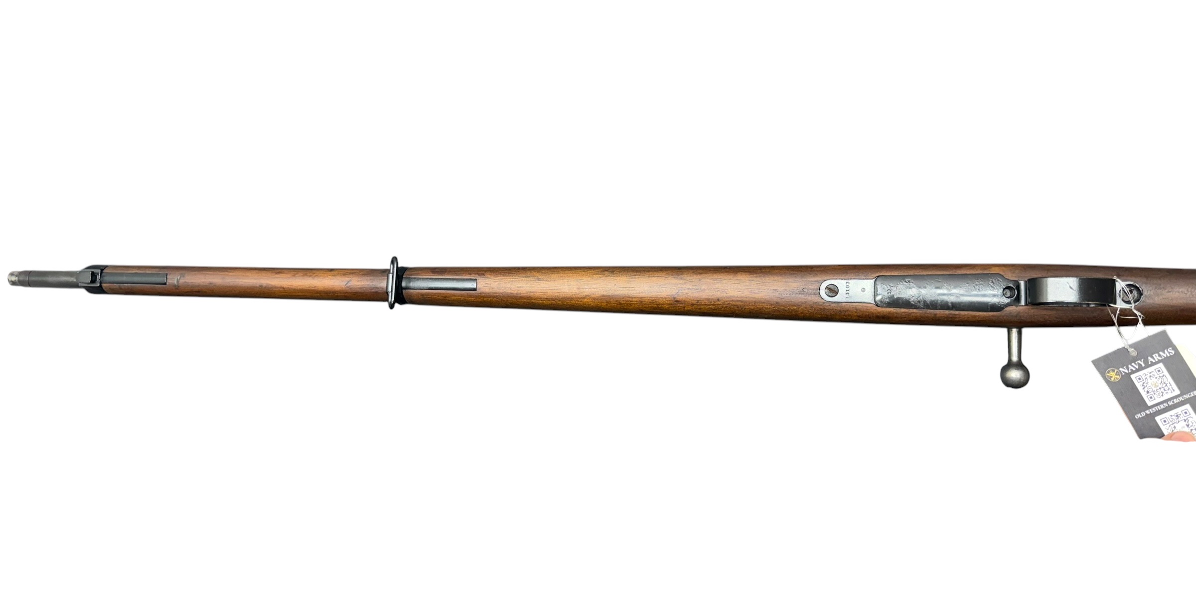 IMG_5335-Photoroom - OWS-Ammo Side view of a vintage wooden rifle with metal fittings and a hanging Navy Arms tag on the right end of the stock.