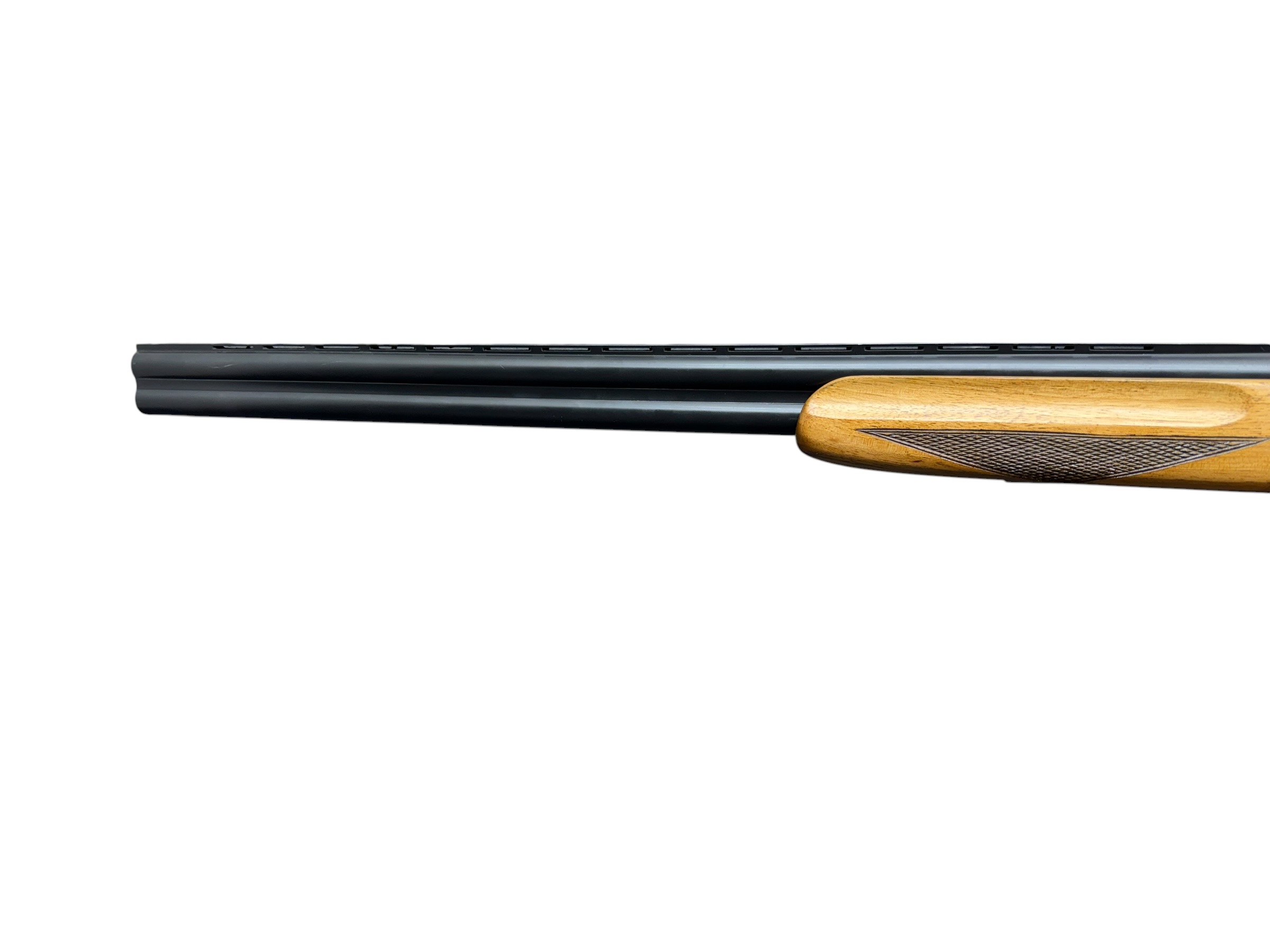 IMG_5374-Photoroom - OWS-Ammo Close-up of a long black shotgun barrel with a wooden checkered stock on the right side.