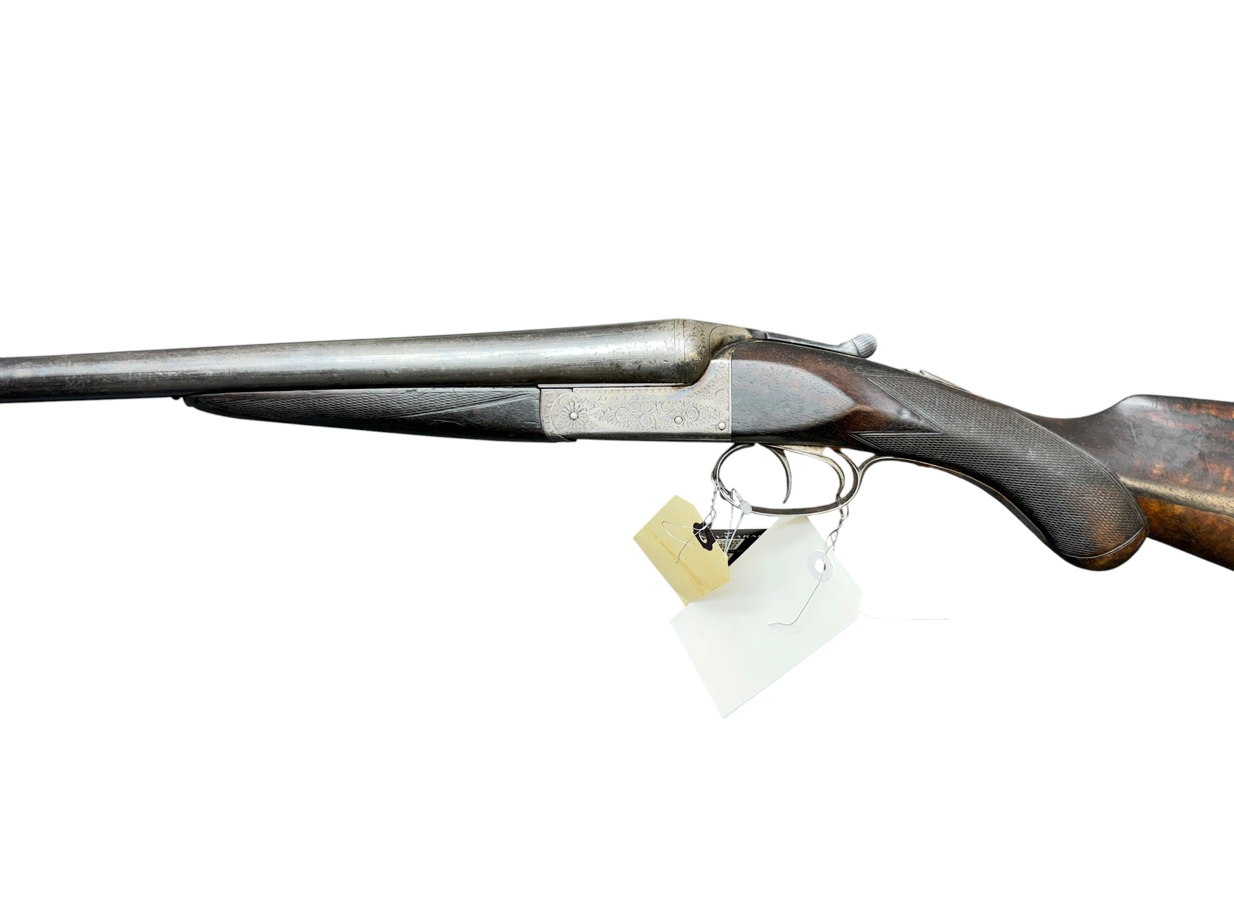 IMG_5389-Photoroom - OWS-Ammo Antique side‑view of a long, engraved muzzle‑loading pistol with a price tag hanging from the trigger guard.