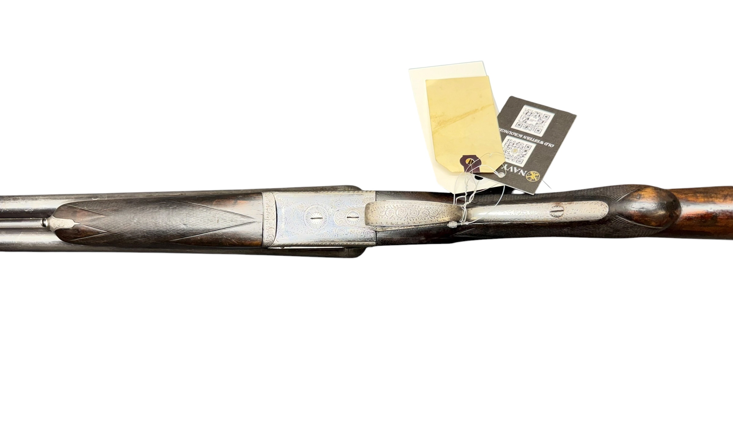 IMG_5391-Photoroom - OWS-Ammo Antique long rifle with engraved metal and attached price tags or labels tied to the stock area.
