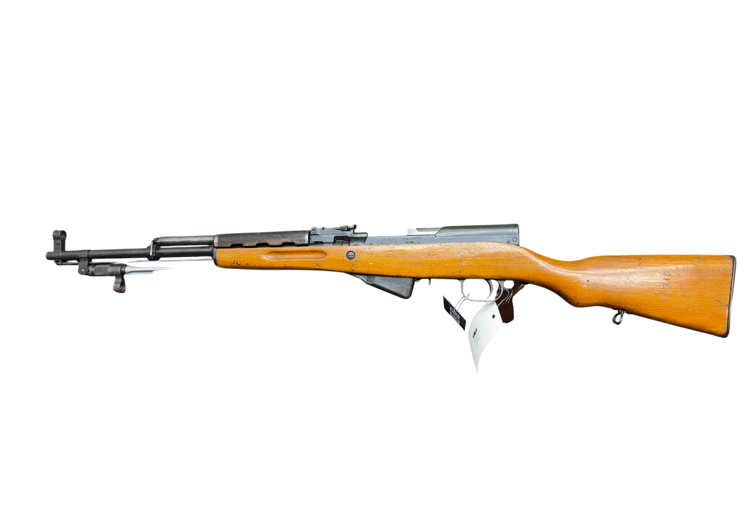 Side view of a bolt-action rifle with a wooden stock and metal barrel against a white background